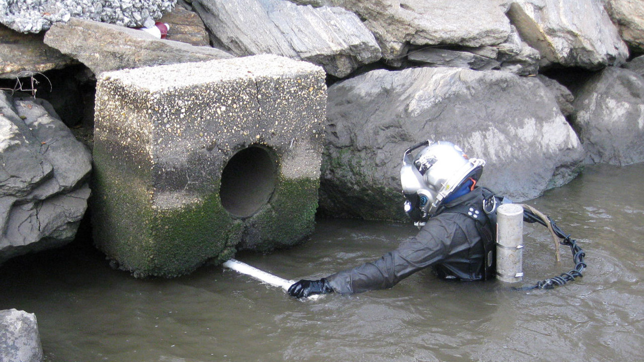 Diver Probing Undermined Sector 7 Outfall Headwall